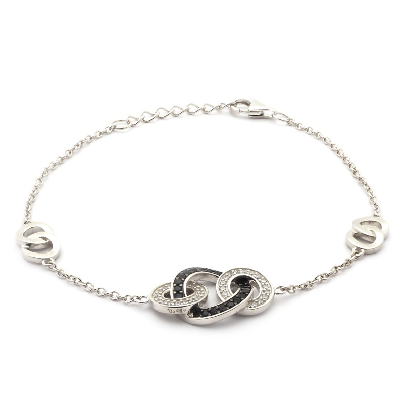 Bracelet en argent aux formes allongées et entrelacées et oxydes de zircunium noirs et blancs