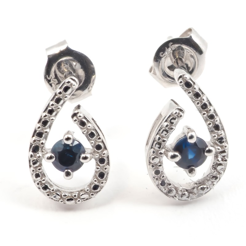 Boucles d'oreilles clous femme carador en or blanc 375/000 et saphir