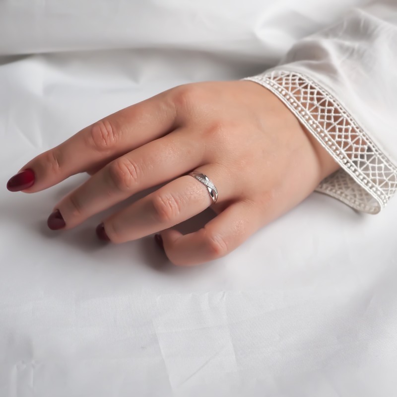 Bague fantaisie femme carador en or blanc 750/000 et diamants motif signe infini