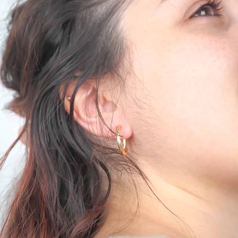 Boucles d'oreilles créoles torsadées femme carador en or jaune 375/000 fil 3mm