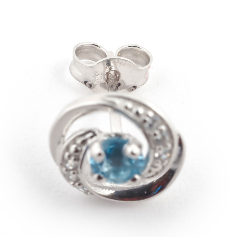 Boucles d'oreilles clous en or blanc 375/000 et topaze