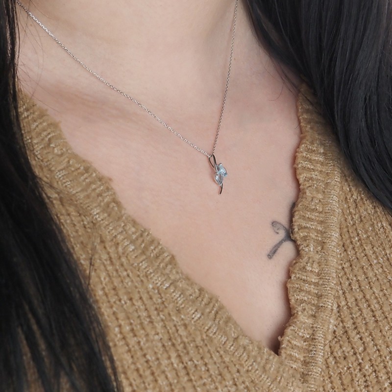 Collier Carador or blanc 375/000 topaze