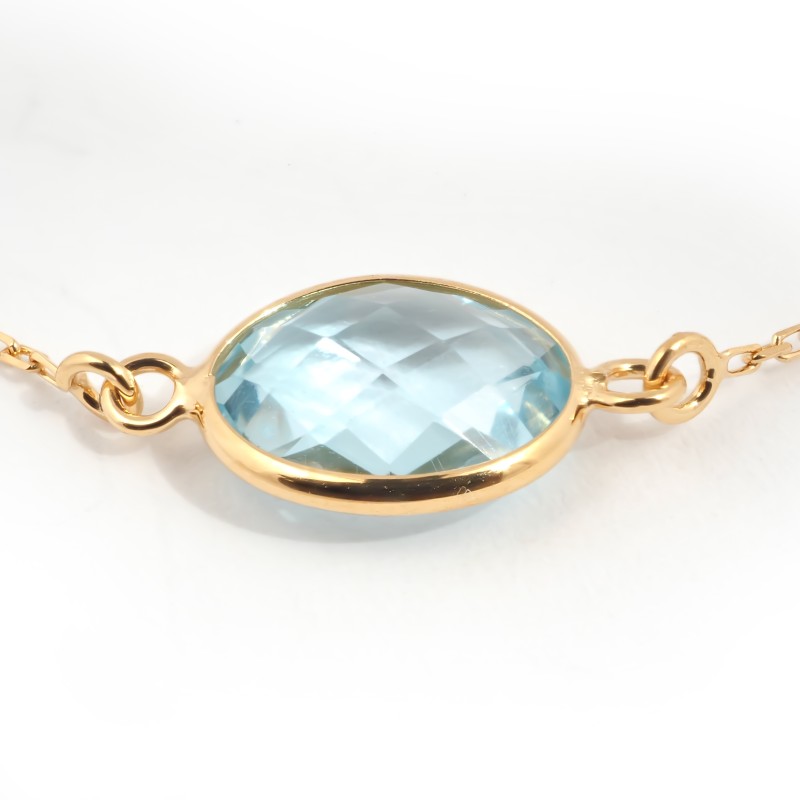 Bracelet fantaisie en or jaune 375/000 et topaze