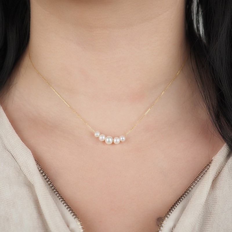 Collier Carador chute de perles en or jaune 375/000