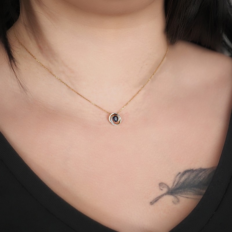Collier Pendentif  Carador en or jaune 375/000, saphir et oxydes de zirconium