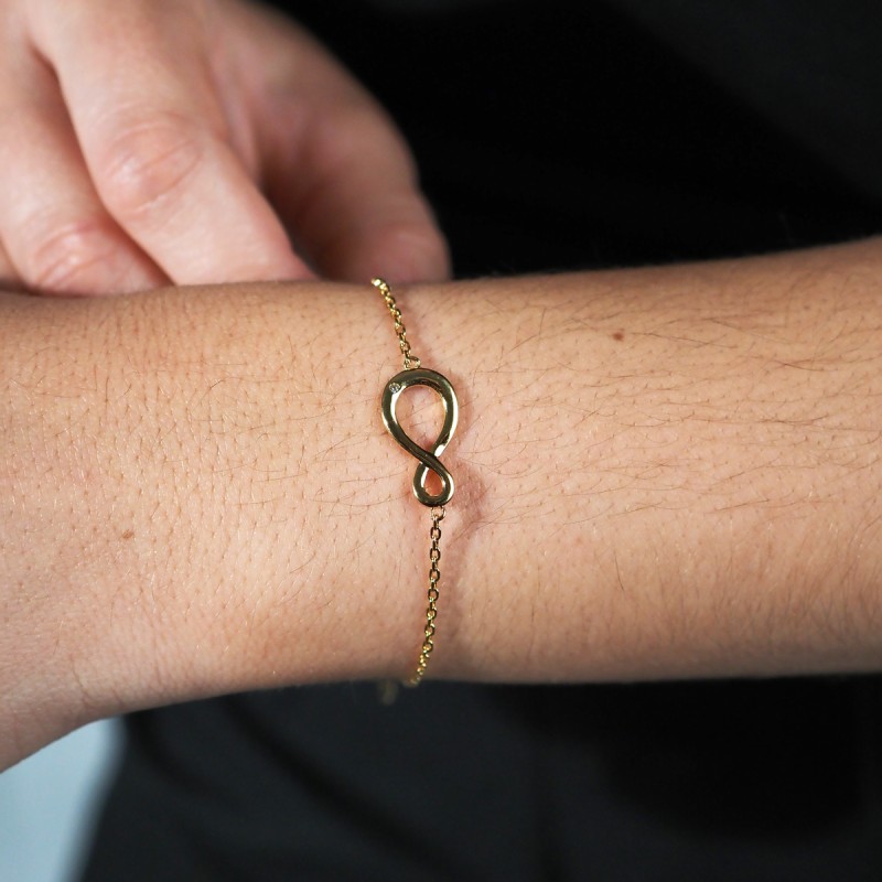 Bracelet fantaisie femme carador en plaqué or avec oxyde de zirconium motif signe infini