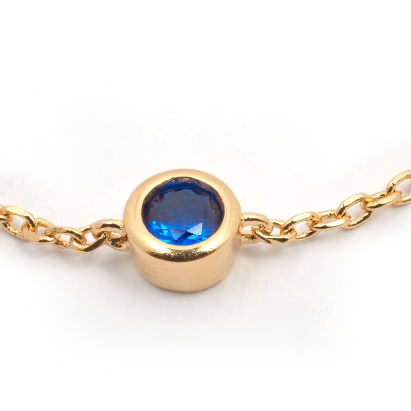 Bracelet solitaire serti clos femme carador en plaqué or avec spinelle bleu