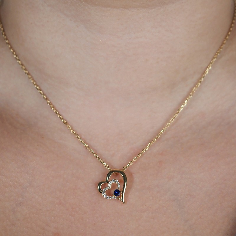 Collier motif cœur femme carador en plaqué or avec spinelle bleu et blanc