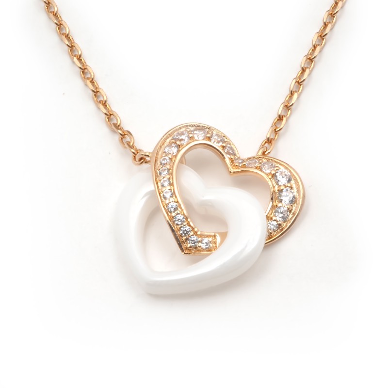 Collier fantaisie doubles coeurs entremêlés femme carador en plaqué or avec oxydes de zirconium et céramique blanche