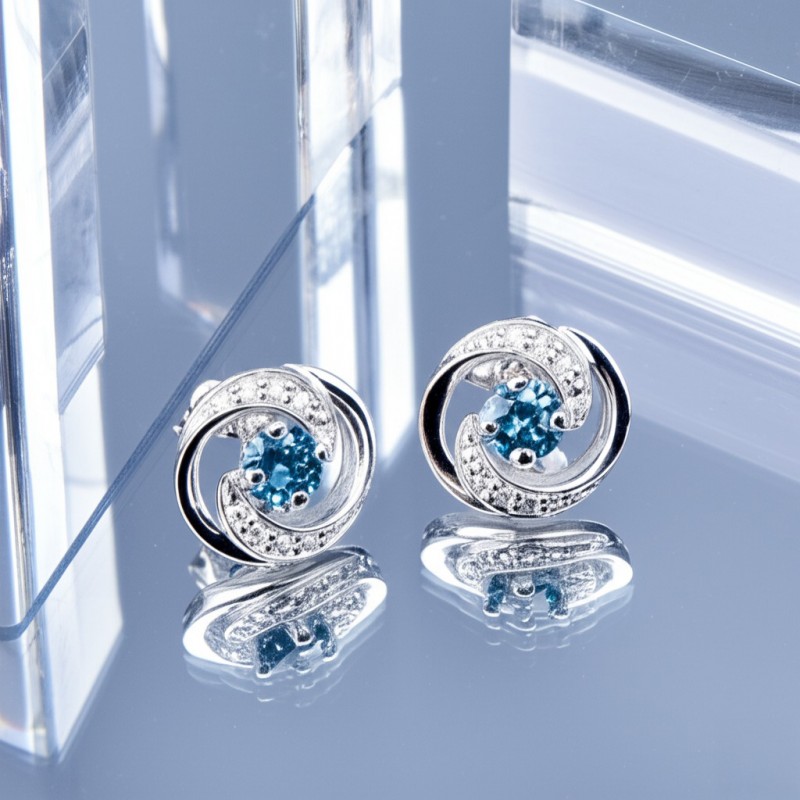 Boucles d'oreilles clous en or blanc 375/000 et topaze