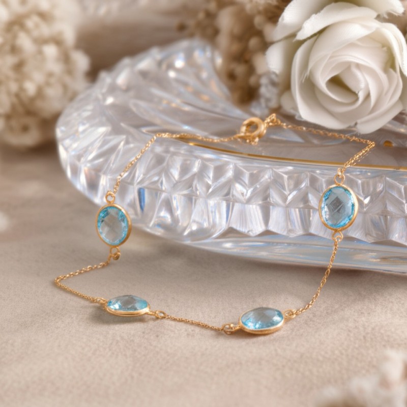 Bracelet fantaisie en or jaune 375/000 et topaze