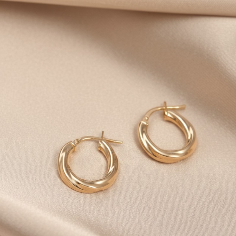 Boucles d'oreilles créoles Carador tube oval torsadé en or jaune 750/000