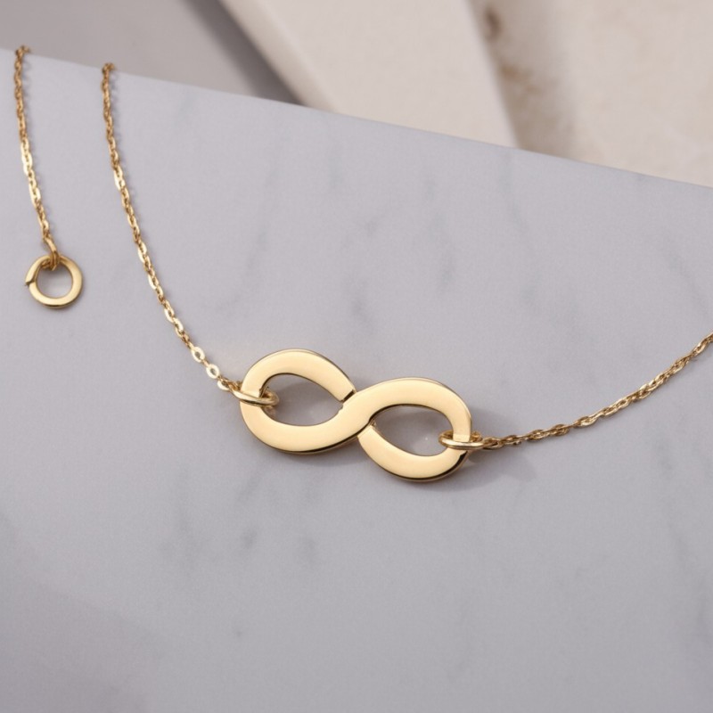 Bracelet en or jaune 750/000 motif infini CARADOR