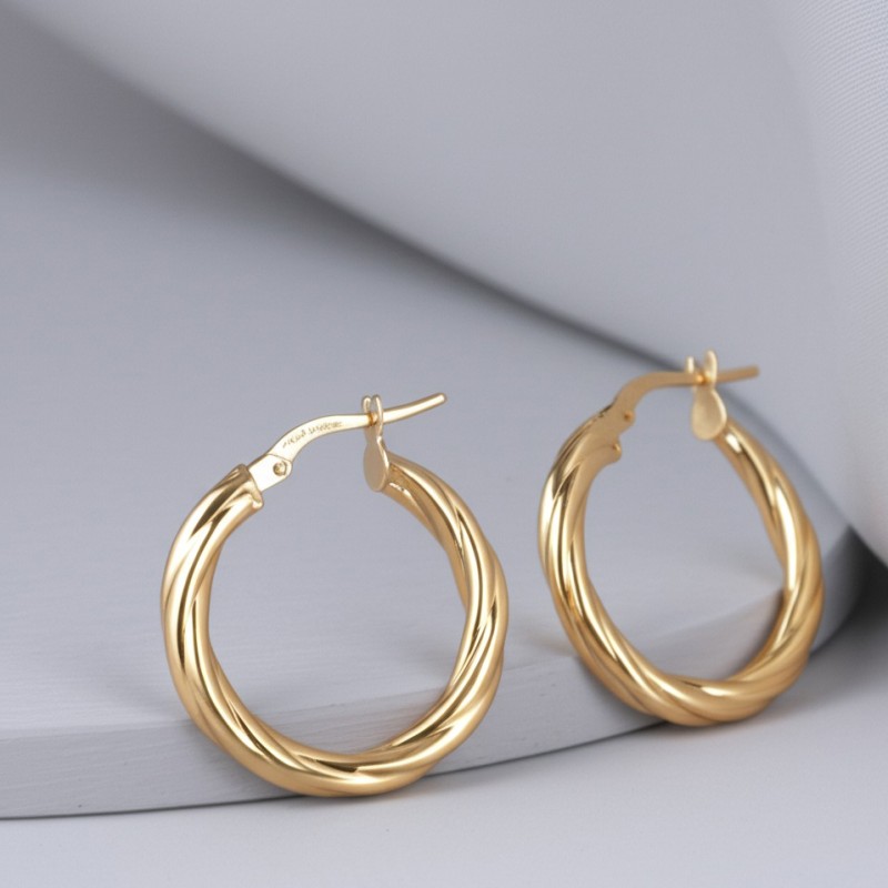 Boucles d'oreilles créoles torsadées femme carador en or jaune 375/000 fil 3mm
