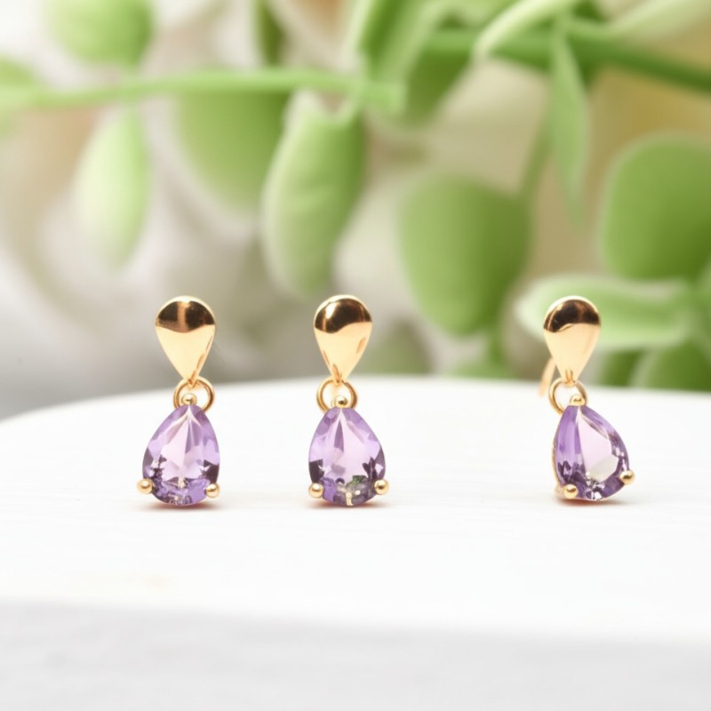 Boucles d'oreilles pendantes en or 375/000 et améthyste