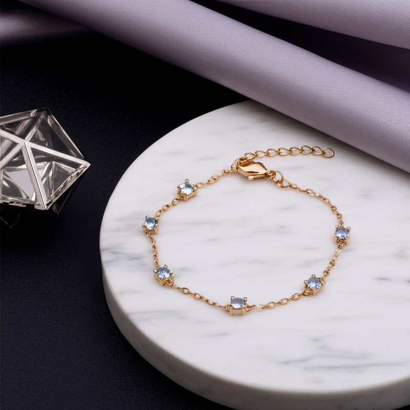 Bracelet fantaisie femme carador en plaqué or avec spinelles bleu clair